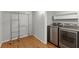 Well-equipped laundry room featuring modern washer and dryer units and ample storage at 4044 Ashentree Dr, Brookhaven, GA 30341