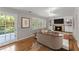 Inviting living room with hardwood floors, a fireplace, and doors leading to the outside at 4044 Ashentree Dr, Brookhaven, GA 30341
