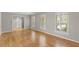 Spacious living room with wood floors and bright, natural light from shuttered windows at 4044 Ashentree Dr, Brookhaven, GA 30341