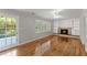 Inviting living room features a brick fireplace, built-in shelves, and access to the outdoors at 4044 Ashentree Dr, Brookhaven, GA 30341