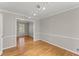 Living room boasts beautiful hardwood floors, crown molding, and neutral wall paint at 4044 Ashentree Dr, Brookhaven, GA 30341
