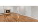 Cozy living room with beautiful hardwood floors and a charming fireplace with built-in shelving at 4044 Ashentree Dr, Brookhaven, GA 30341