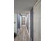 Hallway with blue-grey paint and wood flooring at 6433 Stone Way, Morrow, GA 30260