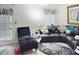 Living room featuring hardwood floors, modern decor, and plenty of natural light at 6433 Stone Way, Morrow, GA 30260