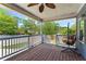 Charming covered back porch with ceiling fan and hanging chair at 756 Ormewood Se Ave, Atlanta, GA 30312