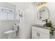 Bathroom featuring granite countertops, vessel sink, and modern lighting at 756 Ormewood Se Ave, Atlanta, GA 30312