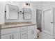 Bathroom with double sinks, granite countertop and decorative mirrors at 756 Ormewood Se Ave, Atlanta, GA 30312