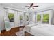 Sunlit main bedroom with patio access, hardwood floors and light airy paint at 756 Ormewood Se Ave, Atlanta, GA 30312