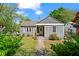 Charming home featuring a well-manicured front lawn and tidy landscaping at 756 Ormewood Se Ave, Atlanta, GA 30312