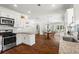 Bright kitchen features stainless appliances, white cabinets, and granite countertops at 756 Ormewood Se Ave, Atlanta, GA 30312