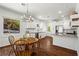 Modern kitchen featuring white cabinets, granite countertops, stainless steel appliances, and hardwood floors at 756 Ormewood Se Ave, Atlanta, GA 30312