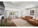 Bright and spacious living room with hardwood floors, large windows, and stylish furnishings at 756 Ormewood Se Ave, Atlanta, GA 30312
