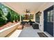 Back porch featuring seating, a fan and a view of the outdoor play area at 2235 Birchtree Way, Marietta, GA 30062