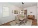 Elegant dining room featuring a rustic wood table, stylish chairs, and a charming bench at 2235 Birchtree Way, Marietta, GA 30062