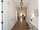 Open-concept hallway with views into the living room and kitchen, showcasing the home's layout at 2235 Birchtree Way, Marietta, GA 30062