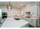Elegant kitchen with white cabinetry, a large center island, and high-end stainless steel appliances at 2235 Birchtree Way, Marietta, GA 30062