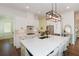 Modern kitchen with a large island, white cabinetry, and stainless steel appliances, perfect for cooking at 2235 Birchtree Way, Marietta, GA 30062
