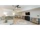 Open living room with light colored flooring, large area rug and ceiling fans at 2235 Birchtree Way, Marietta, GA 30062