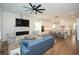 Open concept living room and kitchen with hardwood floors and a fireplace at 2235 Birchtree Way, Marietta, GA 30062