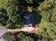Aerial view of a house surrounded by dense trees, showing the roof and driveway at 2340 Bexford Vw, Cumming, GA 30041
