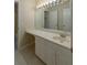 Bright bathroom features a vanity with ample storage and a large mirror at 2340 Bexford Vw, Cumming, GA 30041