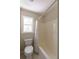 Standard bathroom with a shower and tub combination and a window providing natural light at 2340 Bexford Vw, Cumming, GA 30041