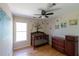 Charming Bedroom with hardwood floors, playful wall art, and a classic wooden crib, creating a cozy space at 2340 Bexford Vw, Cumming, GA 30041