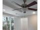 Bedroom with ceiling fan, large window and neutral paint tones, with a glimpse into a closet at 2340 Bexford Vw, Cumming, GA 30041
