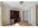 Versatile room with wood floors, built-in shelving, and a closet, ideal for an office or guest bedroom at 2340 Bexford Vw, Cumming, GA 30041