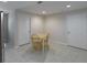 Dining area with seating, neutral paint and tile flooring. Doors to the side offer an easy escape at 2340 Bexford Vw, Cumming, GA 30041