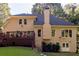 Back of home featuring a deck with access to the backyard and multiple windows at 2340 Bexford Vw, Cumming, GA 30041