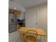 Cozy kitchenette featuring a table, stainless steel appliances, and neutral color scheme at 2340 Bexford Vw, Cumming, GA 30041