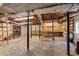 View of unfinished basement with exposed duct work, shelving, and concrete floor at 2927 Ponderosa Cir, Decatur, GA 30033