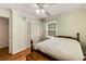 Bedroom with hardwood floors, ceiling fan, and natural light at 2927 Ponderosa Cir, Decatur, GA 30033