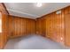 Cozy bedroom with wood paneling and neutral carpet flooring, perfect for relaxation at 2927 Ponderosa Cir, Decatur, GA 30033