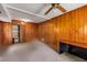 View of bedroom with wood paneling and closet with organizers, perfect for storage at 2927 Ponderosa Cir, Decatur, GA 30033