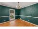 Cozy dining room with hardwood floors and a vintage chandelier at 2927 Ponderosa Cir, Decatur, GA 30033