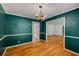 This dining room features hardwood floors, a vintage chandelier and great natural light at 2927 Ponderosa Cir, Decatur, GA 30033