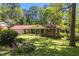 Inviting single-Gathering home with a lush green lawn, complemented by mature trees offering shade and privacy at 2927 Ponderosa Cir, Decatur, GA 30033