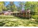 Beautiful brick home with a well-maintained lawn, mature trees, and an attached garage for convenience at 2927 Ponderosa Cir, Decatur, GA 30033