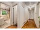 Hallway with hardwood floors and access to bathroom, bedrooms and stairs to basement at 2927 Ponderosa Cir, Decatur, GA 30033