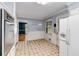 Eat-in kitchen featuring white appliances and ample counter space at 2927 Ponderosa Cir, Decatur, GA 30033
