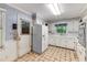 Cozy kitchen featuring white appliances, vintage decor and ample counter space at 2927 Ponderosa Cir, Decatur, GA 30033