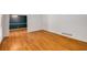Open-concept living room with gleaming hardwood floors and natural light at 2927 Ponderosa Cir, Decatur, GA 30033