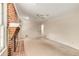 Bright living room features a brick fireplace, ceiling fan, and neutral carpet at 2927 Ponderosa Cir, Decatur, GA 30033