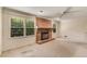 Spacious living room features a brick fireplace and large windows overlooking the yard at 2927 Ponderosa Cir, Decatur, GA 30033