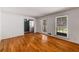 Spacious living room featuring gleaming hardwood floors and large windows at 2927 Ponderosa Cir, Decatur, GA 30033
