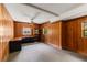 Office space featuring wood paneling, windows, and built-in shelving, ideal for remote work at 2927 Ponderosa Cir, Decatur, GA 30033