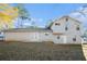 Backyard featuring a well-maintained lawn, patio, and siding, with a blue sky above at 3448 Great Meadows Ct, Lithonia, GA 30038