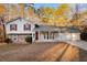 Charming two-story home with a three car garage, complemented by stone accents and a well-manicured front yard at 3448 Great Meadows Ct, Lithonia, GA 30038